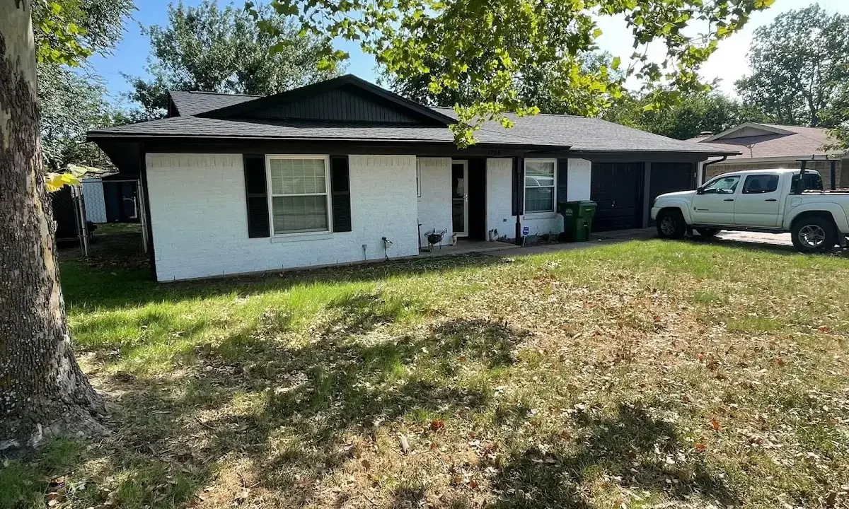 Professional roofing crew working on a residential roof in Muskego